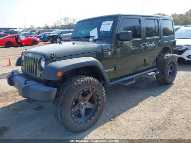 1C4BJWDG9FL599827 Jeep Wrangler Unlimited Sport