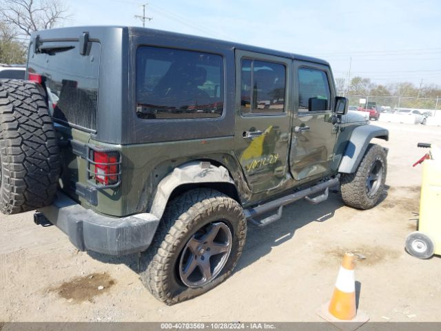 1C4BJWDG9FL599827 Jeep Wrangler Unlimited Sport