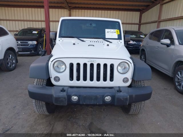 1C4BJWDG5EL307993 Jeep Wrangler Unlimited Sport