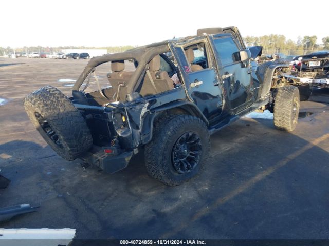 1C4BJWDG7EL119878 Jeep Wrangler Unlimited Sport