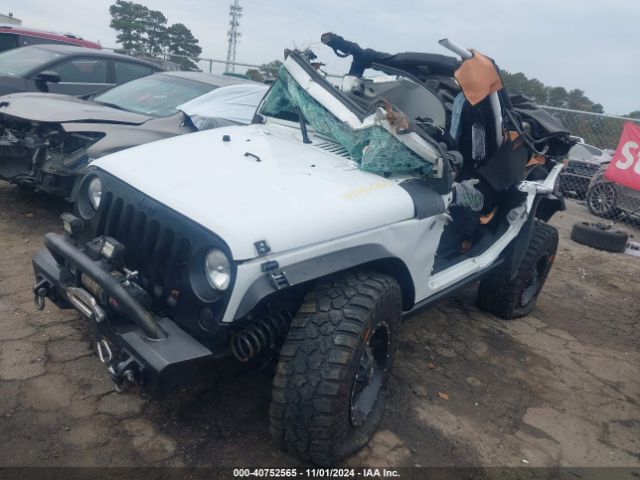 1C4AJWBG9EL327517 Jeep Wrangler Sahara