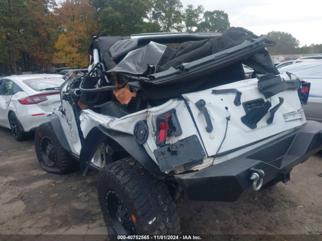 1C4AJWBG9EL327517 Jeep Wrangler Sahara