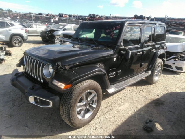 1C4HJXEG9KW525203 Jeep Wrangler Unlimited Sahara 4x4
