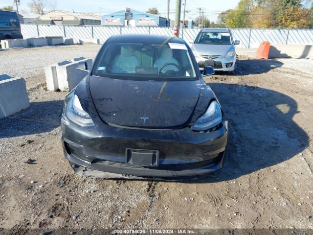 5YJ3E1EB3KF421889 Tesla 2019