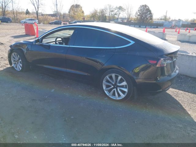 5YJ3E1EB3KF421889 Tesla 2019
