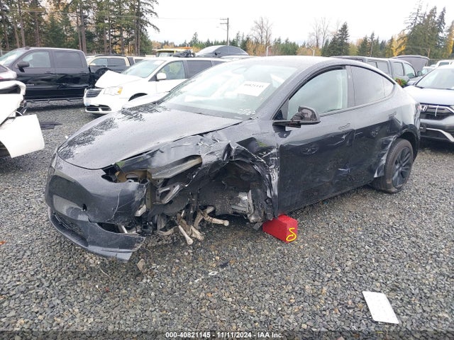 2024 TESLA MODEL Y 7SAYGDEE7RF102522 Photo 1