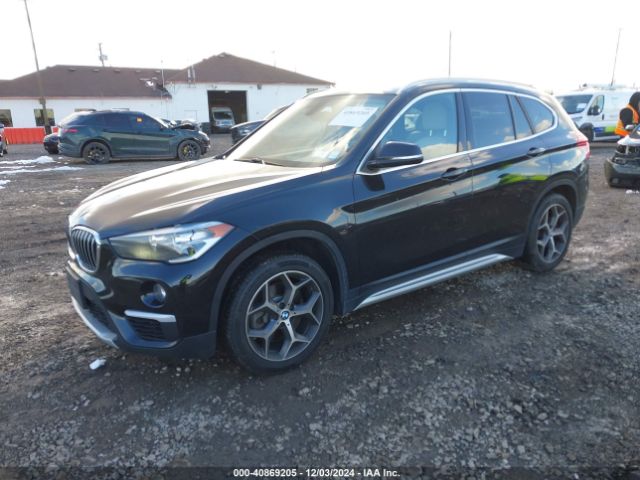 2018 BMW X1 WBXHT3C30J3H32488 Photo 1