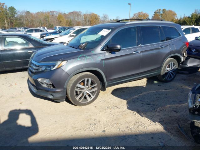 5FNYF6H04HB100236 Honda Pilot Elite