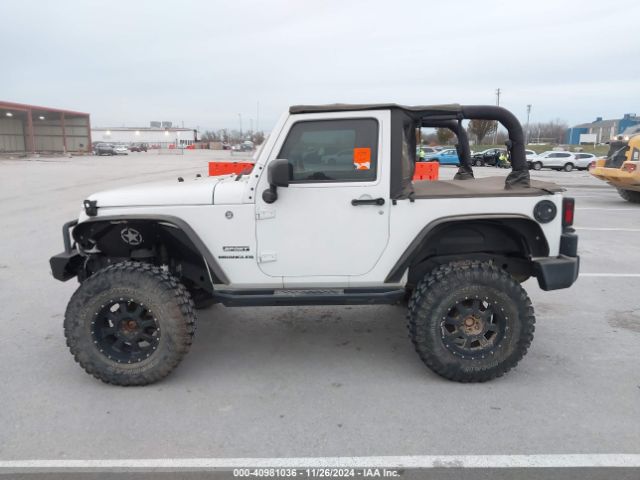 1C4AJWAG9GL297973 Jeep Wrangler Sport