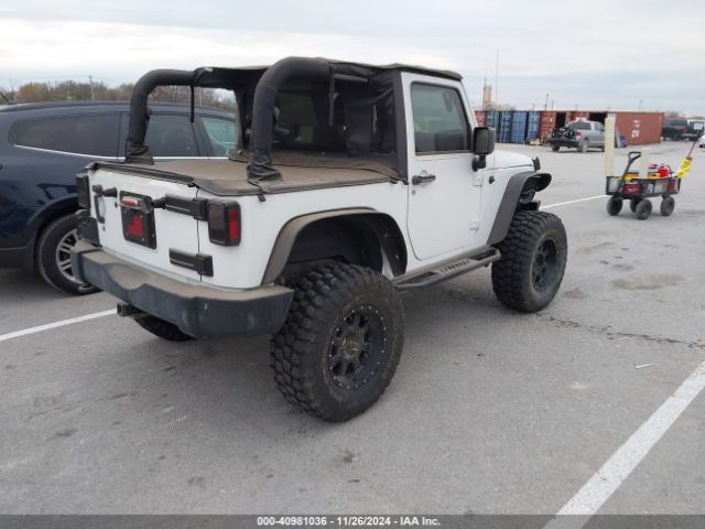 1C4AJWAG9GL297973 Jeep Wrangler Sport