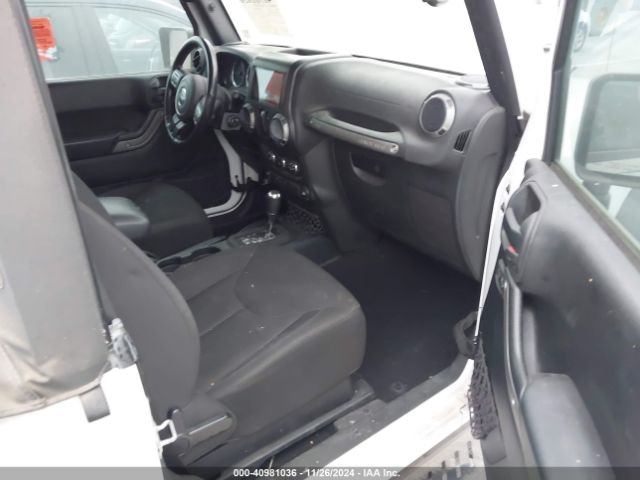 1C4AJWAG9GL297973 Jeep Wrangler Sport
