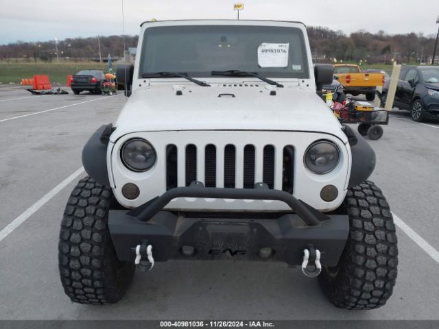 1C4AJWAG9GL297973 Jeep Wrangler Sport
