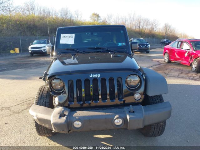 1C4AJWAG7FL611909 Jeep Wrangler Sport