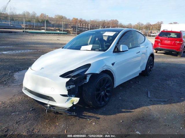 2021 TESLA MODEL Y 5YJYGAEEXMF185304 Photo 1