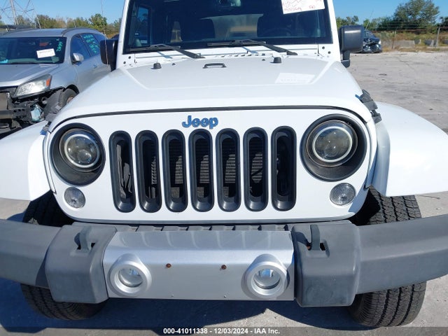 1C4BJWEG4EL213599 Jeep Wrangler Unlimited Sahara