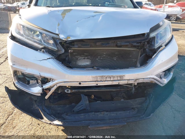 2HKRM4H34GH614838 Honda CR-V LX