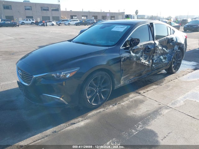 JM1GJ1W56G1435579 Mazda py