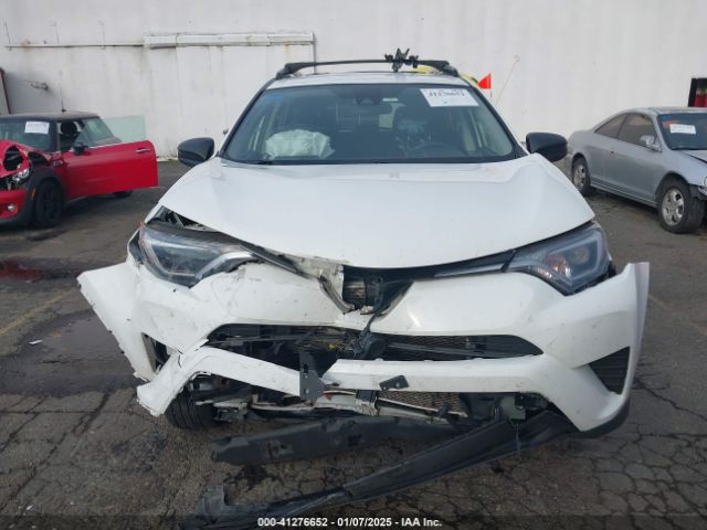 JTMBFREV9JJ254463 Toyota RAV4 LE