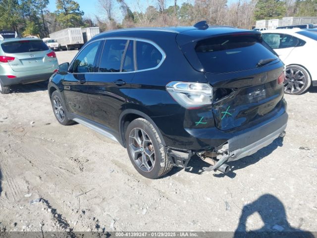 2017 BMW X1 WBXHT3C34H5F70525 Photo 2