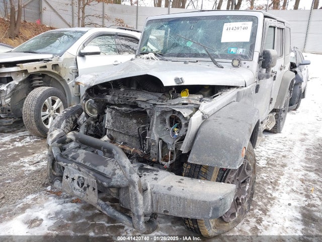 1C4HJWDG1EL302087 Jeep Wrangler Unlimited Sport