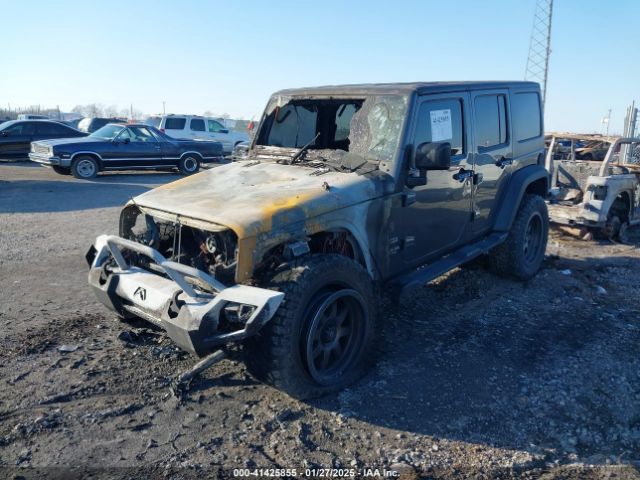 1C4HJWDG0EL299053 Jeep Wrangler Unlimited Sport