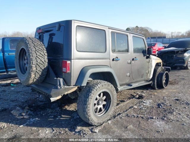 1C4HJWDG0EL299053 Jeep Wrangler Unlimited Sport