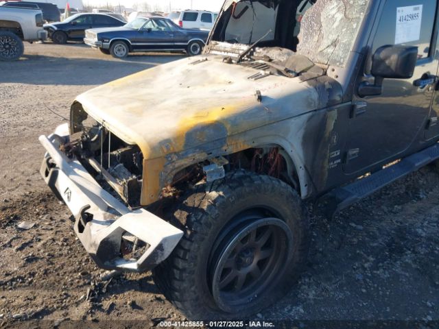 1C4HJWDG0EL299053 Jeep Wrangler Unlimited Sport