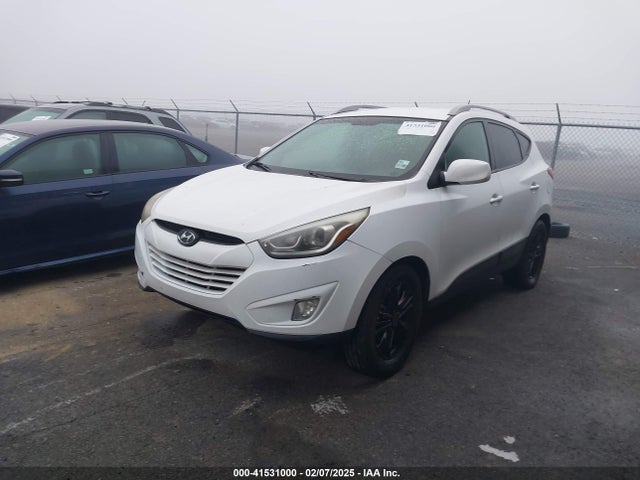 KM8JU3AG0EU880635 Hyundai TUCSON SE