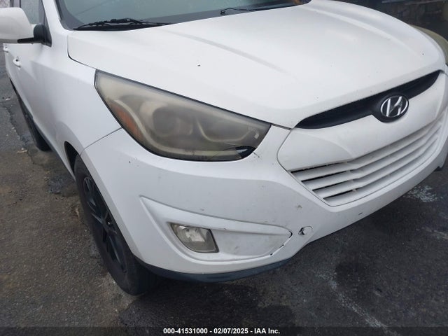 KM8JU3AG0EU880635 Hyundai TUCSON SE
