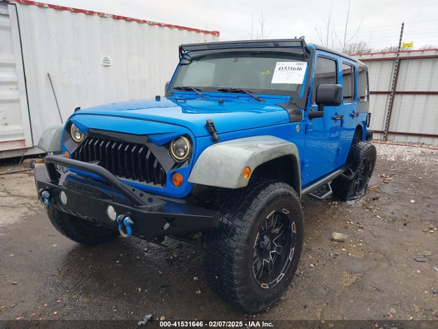 41531646 :رقم المزاد ، 1J4BA3H11BL600915 vin ، 2011 Jeep Wrangler Unlimited Sport مزاد بيع