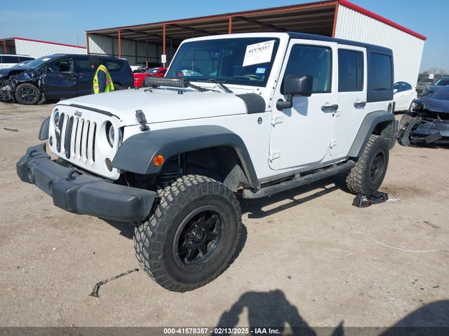 1C4BJWDG2EL100591 Jeep Wrangler Unlimited Sport