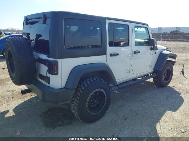 1C4BJWDG2EL100591 Jeep Wrangler Unlimited Sport
