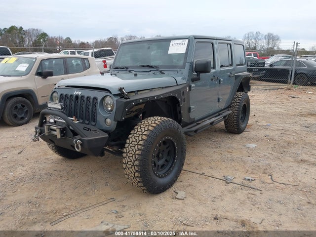 1C4BJWDG9EL104220 Jeep Wrangler Unlimited Sport
