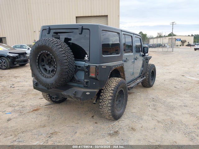 1C4BJWDG9EL104220 Jeep Wrangler Unlimited Sport