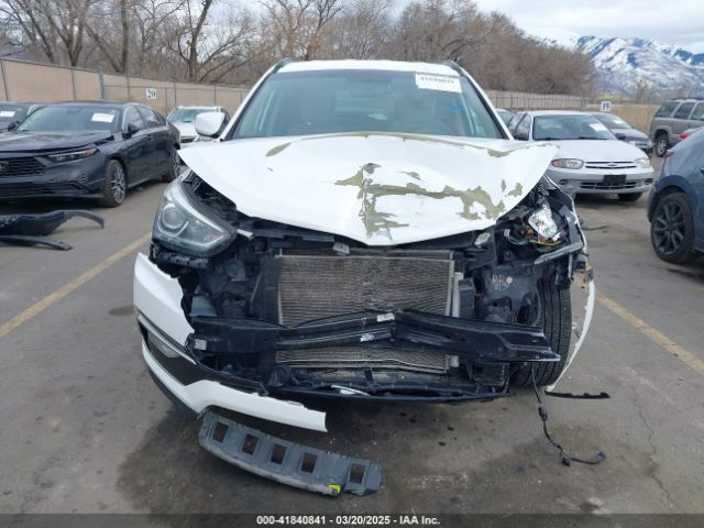 5NMZU3LB9HH011858 Hyundai Santa Fe Sport 2.4l