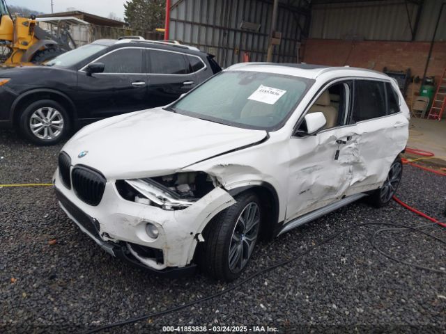 2017 BMW X1 WBXHT3C36H5F74818 Photo 1