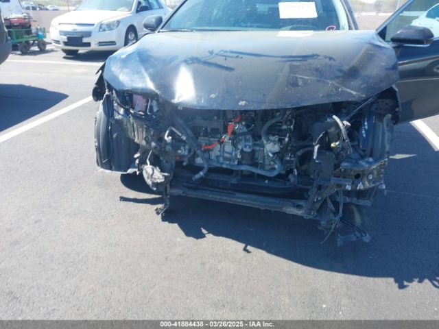 4T1F31AK5NU594457 Toyota Camry Xle Hybrid