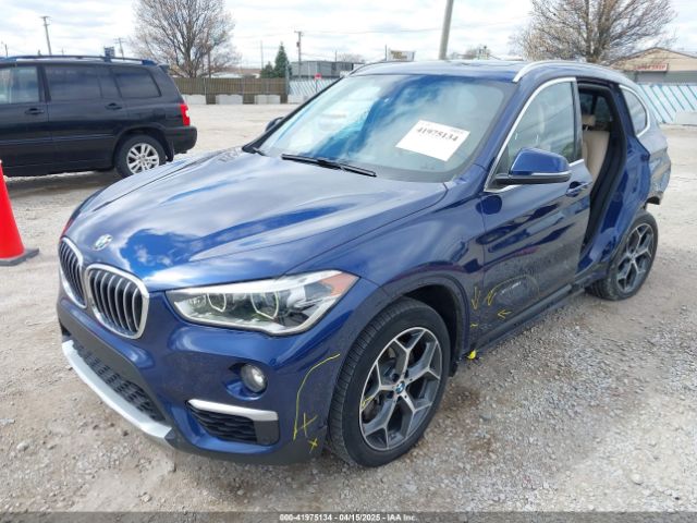 2017 BMW X1 WBXHT3C39H5F70584 Photo 1