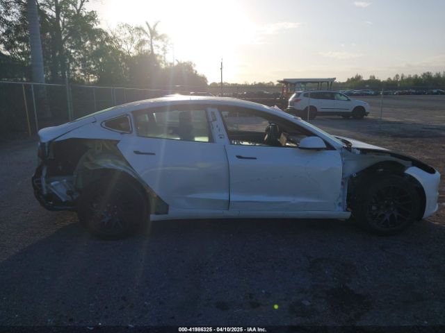 5YJ3E1EA8RF848616 Tesla 2024