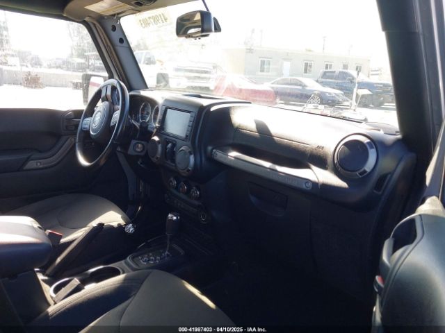 1C4BJWDG5GL309813 Jeep Wrangler Unlimited Sport