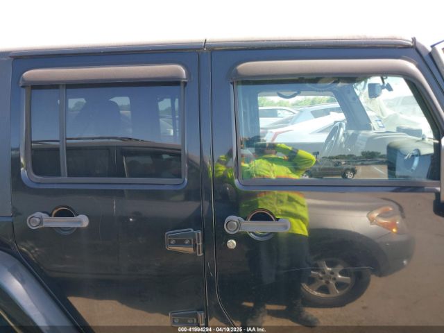 1C4HJWDG7EL235219 Jeep Wrangler Unlimited Freedom Edition