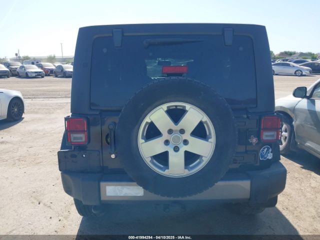 1C4HJWDG7EL235219 Jeep Wrangler Unlimited Freedom Edition