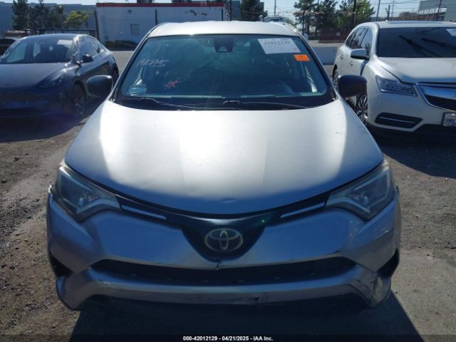 JTMZFREV9JJ162297 Toyota RAV4 LE