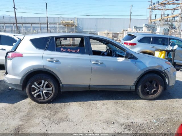 JTMZFREV9JJ162297 Toyota RAV4 LE