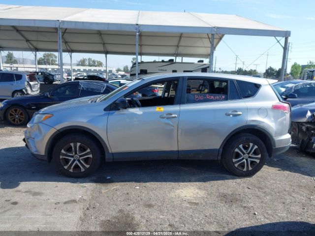 JTMZFREV9JJ162297 Toyota RAV4 LE