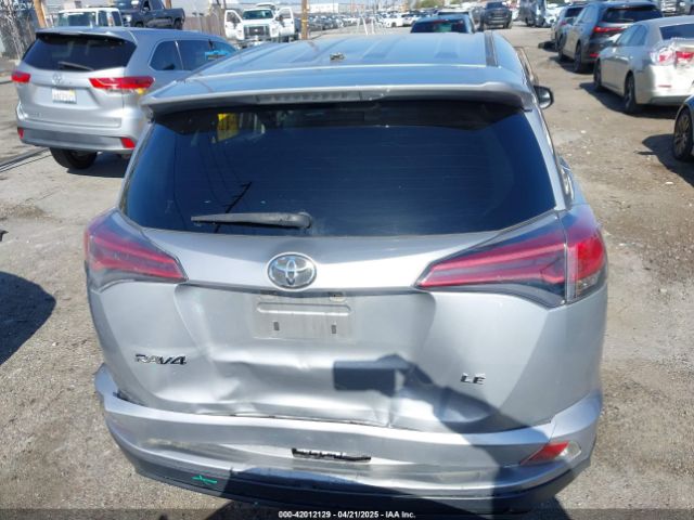 JTMZFREV9JJ162297 Toyota RAV4 LE