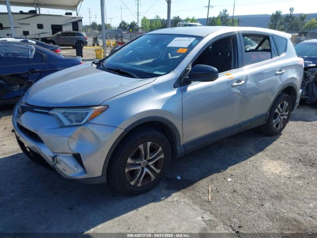 JTMZFREV9JJ162297 Toyota RAV4 LE