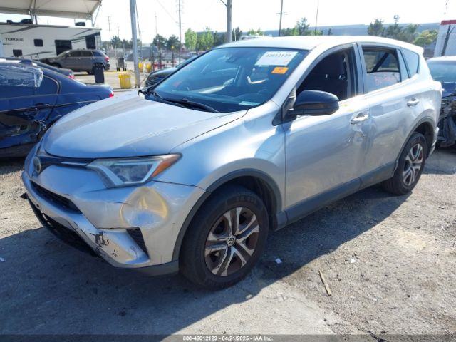 JTMZFREV9JJ162297 Toyota RAV4 LE