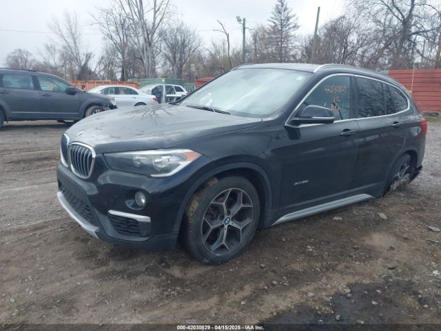 2018 BMW X1 WBXHT3Z36J4A66772 Photo 1
