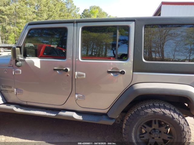 1C4HJWDG6EL310007 Jeep Wrangler Unlimited Sport